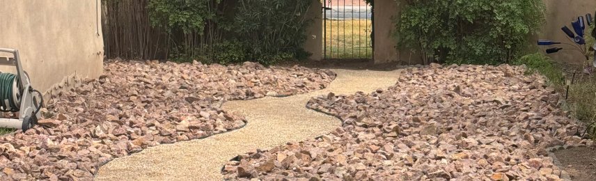 Brainard's Greenscapes backyard stormwater drainage and dry creek bed in Las Cruces