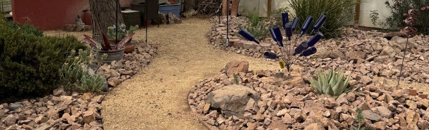 Brainard's Greenscapes backyard French drain and dry creek bed in Las Cruces